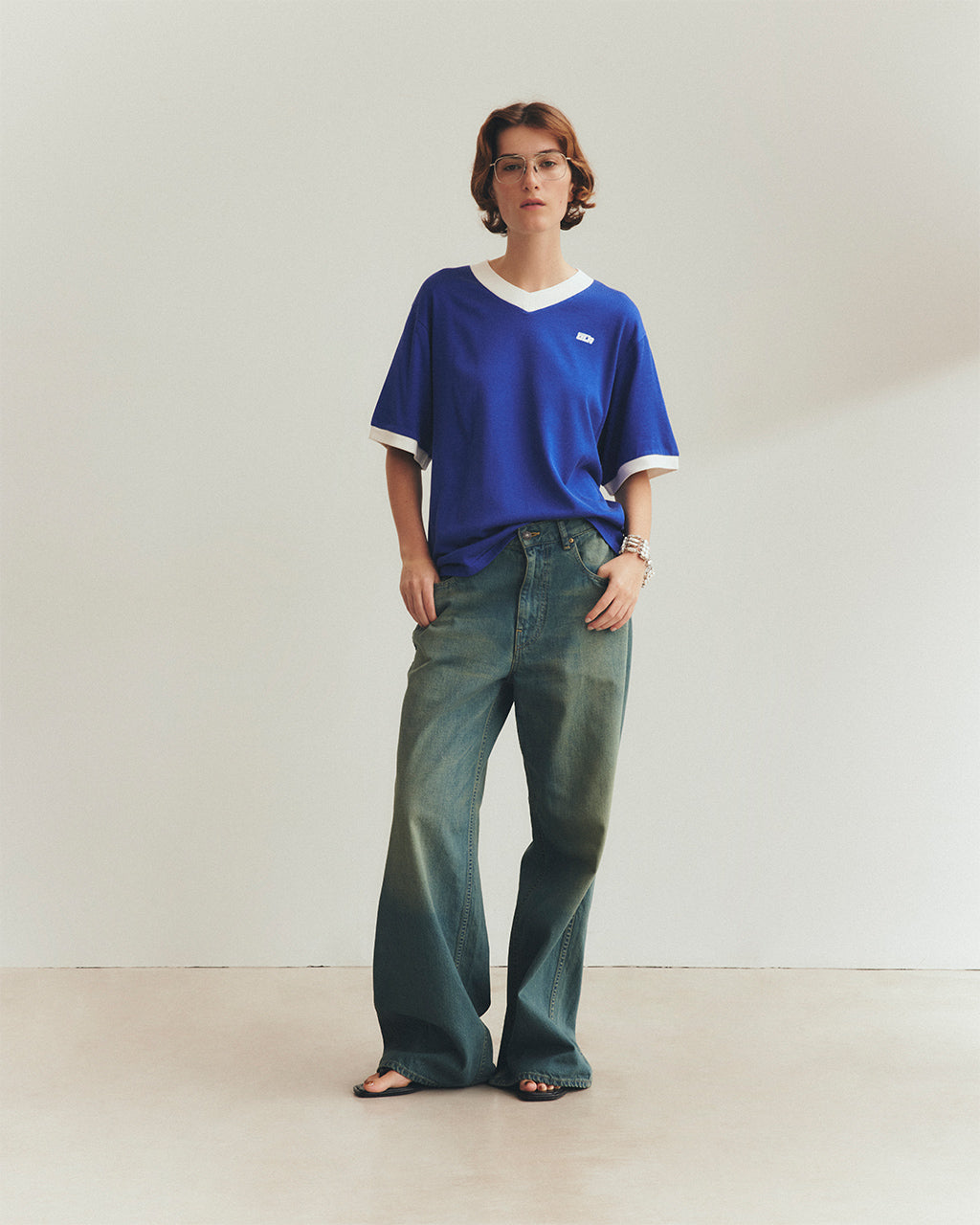 THE SHINZONE シンゾーン オブリガード 半袖Tシャツ ロゴ Vネック カットソー プレーティング天竺 フットボール風 バックプリント OBRIGADO TEE 25MMSCU02【送料無料】