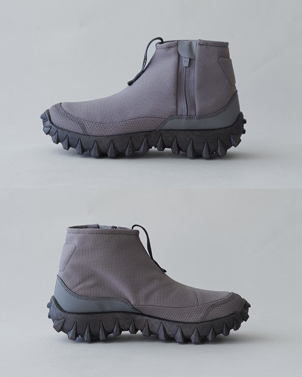 サロモン SNOWCLOG MID のグレー系アッパーとボリュームのあるソールを横から見たショートブーツの側面写真。撥水素材と独特のラグ状ソールが特徴的。